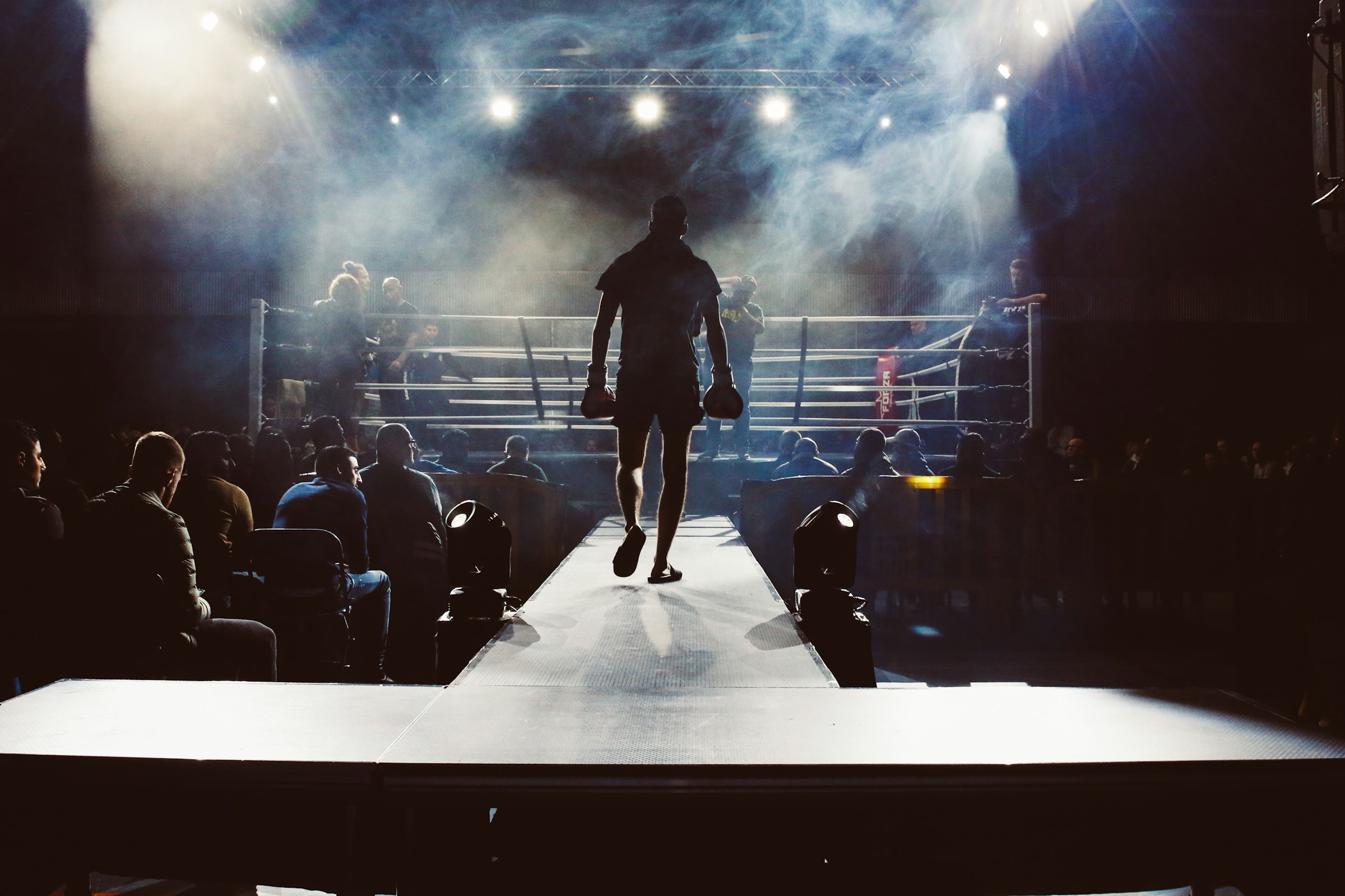 Man walking towards boxing ring